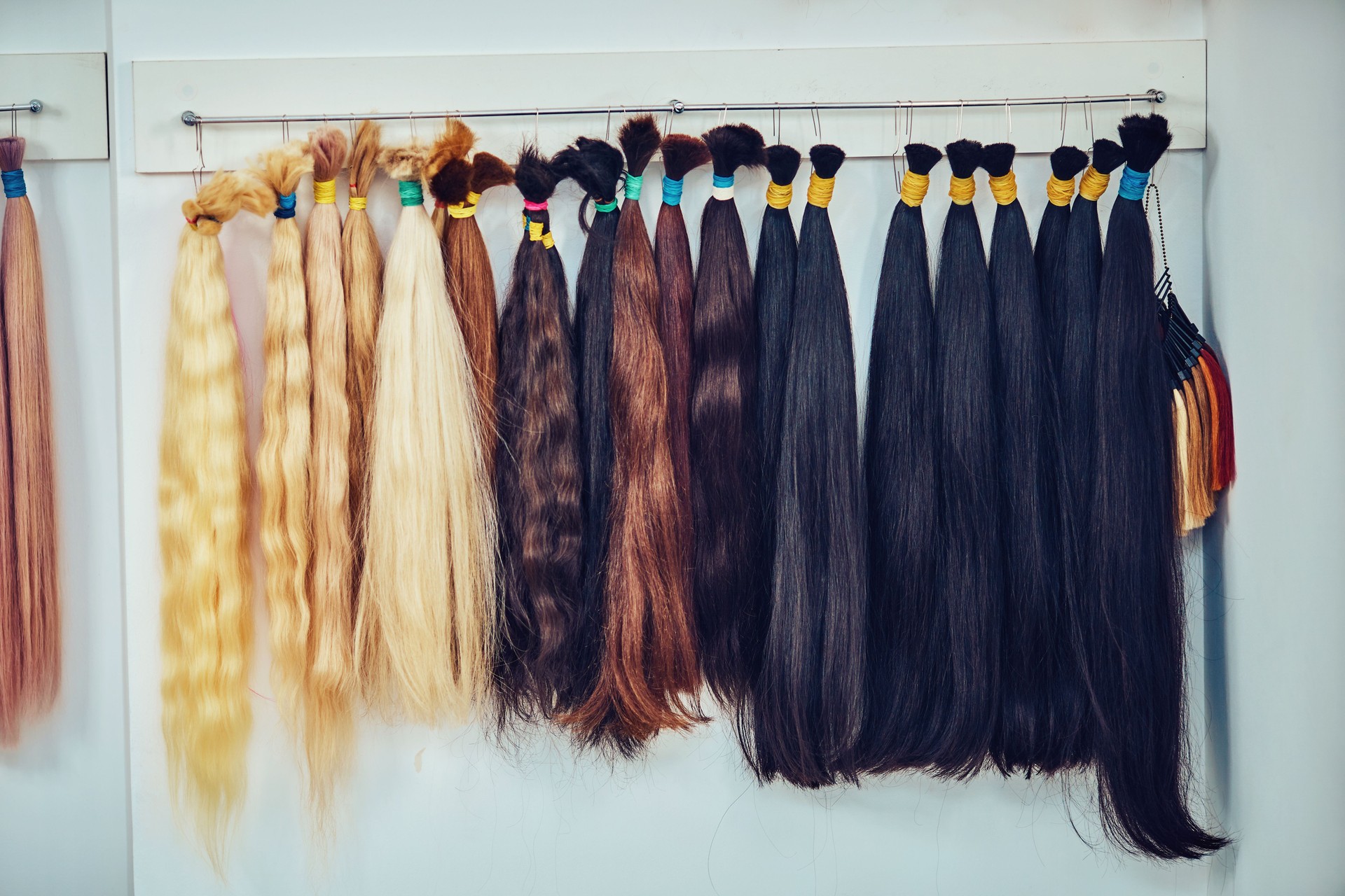 Premium hair extension palette with color samples from blonde to